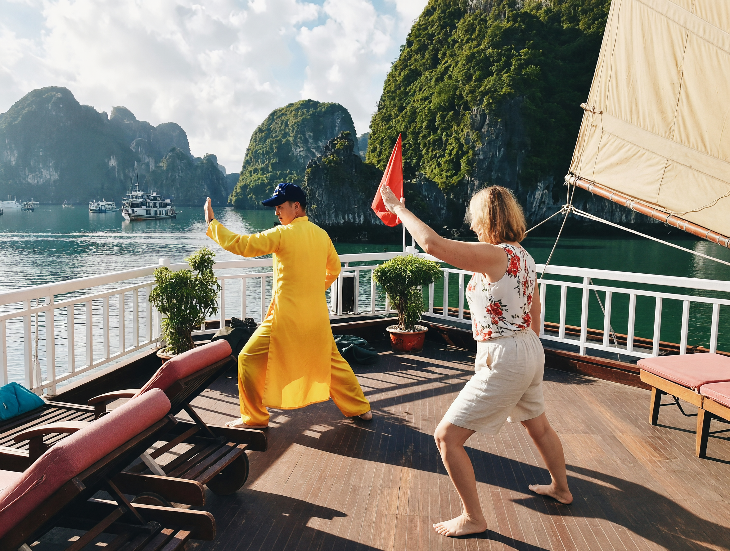 Sunrise tai chi session on the deck of a Ha Long Bay cruise